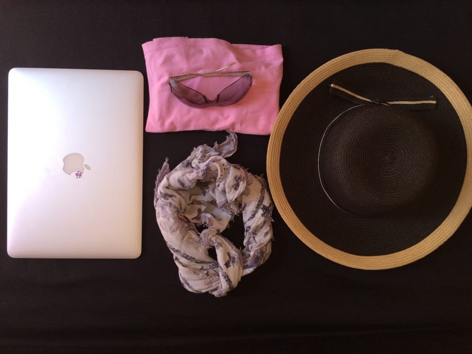 silver macbook and black and brown sun hat and floral infinity scarf preview