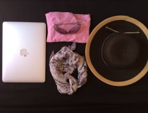 silver macbook and black and brown sun hat and floral infinity scarf thumbnail