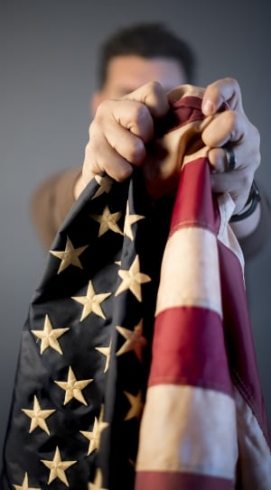person holding a usa flag thumbnail