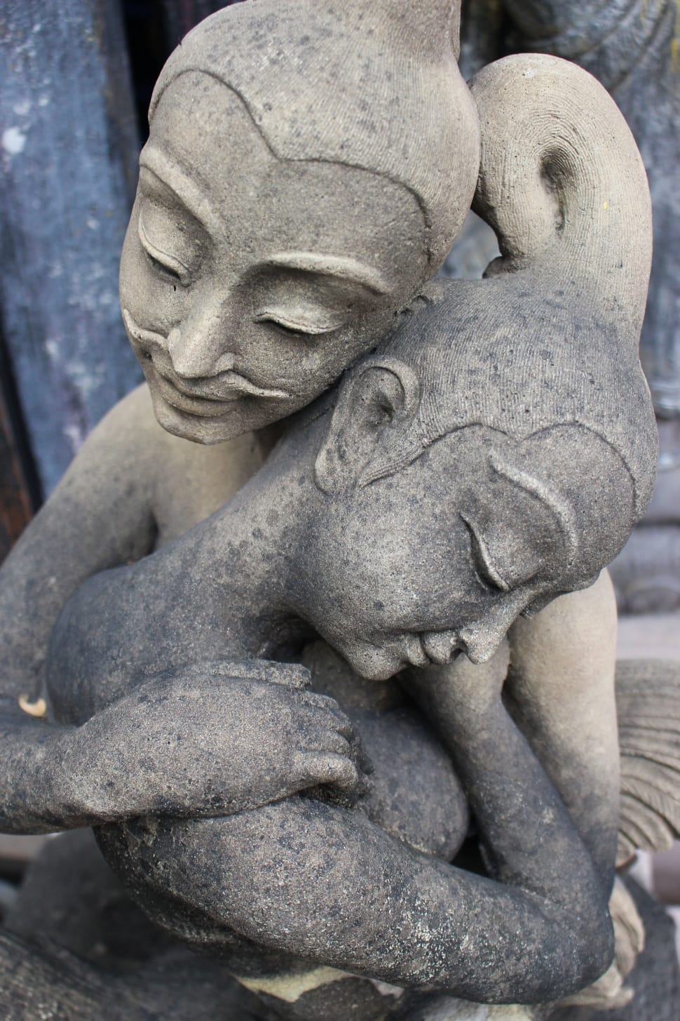 2 women hugging concrete figurine preview
