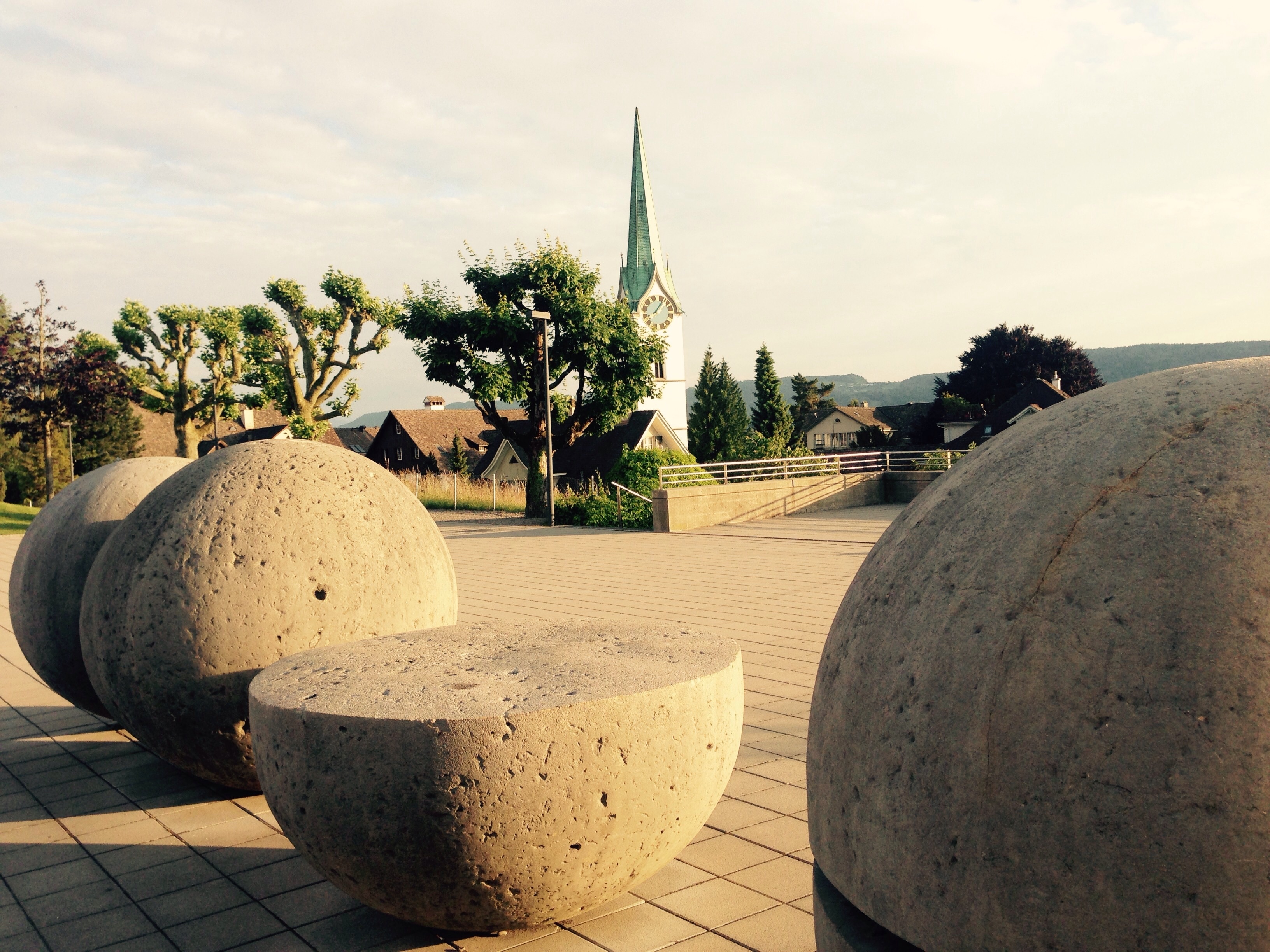 gray concrete round statues