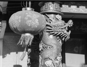 gray hanging lantern near a dragon totem thumbnail
