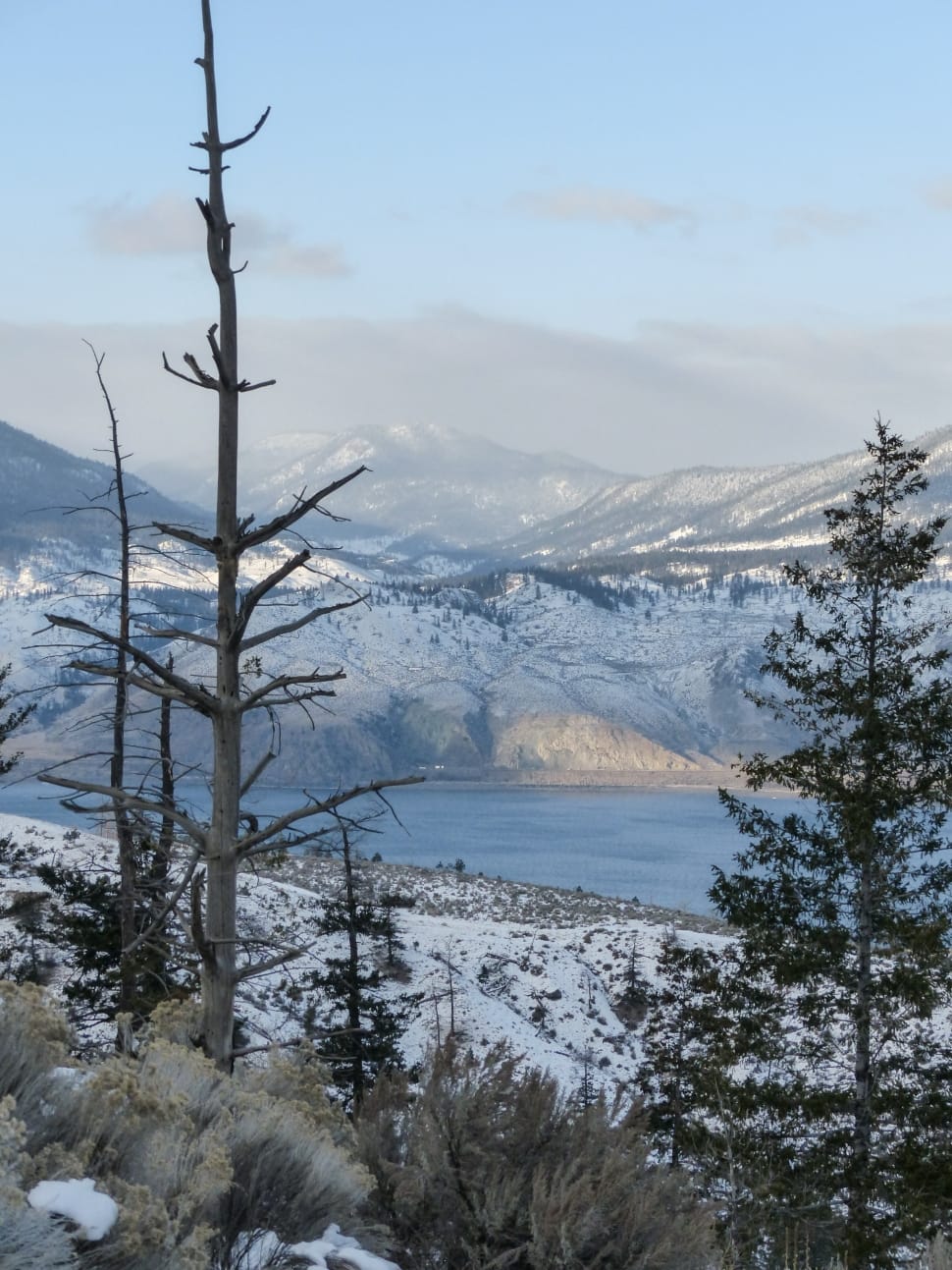 snow covered lakefront mountains preview