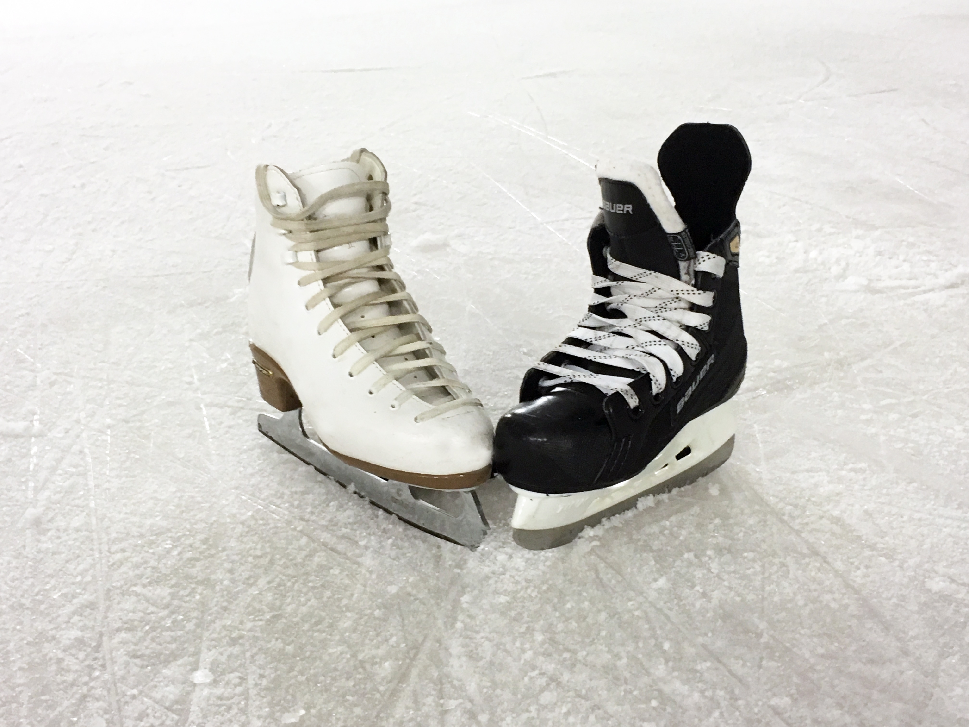 white and black ice skates