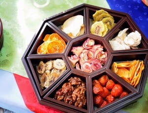 brown wooden tray with assorted food thumbnail
