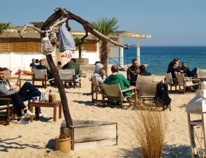 people in brown lounger on seashore lot thumbnail