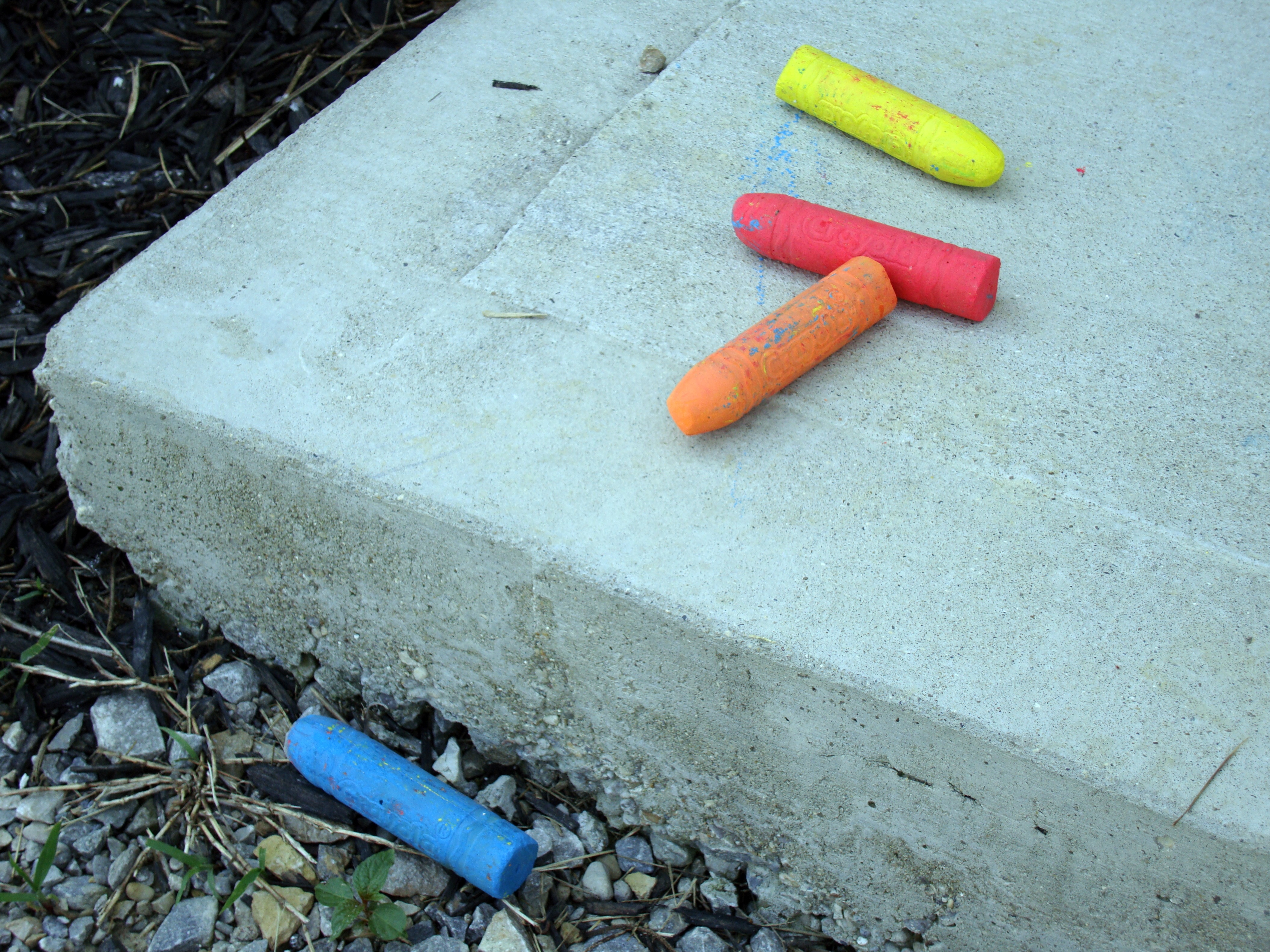 blue orange red and yellow crayon