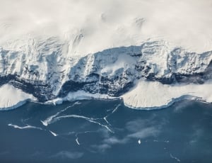 aerial photography of snow coated cliff thumbnail