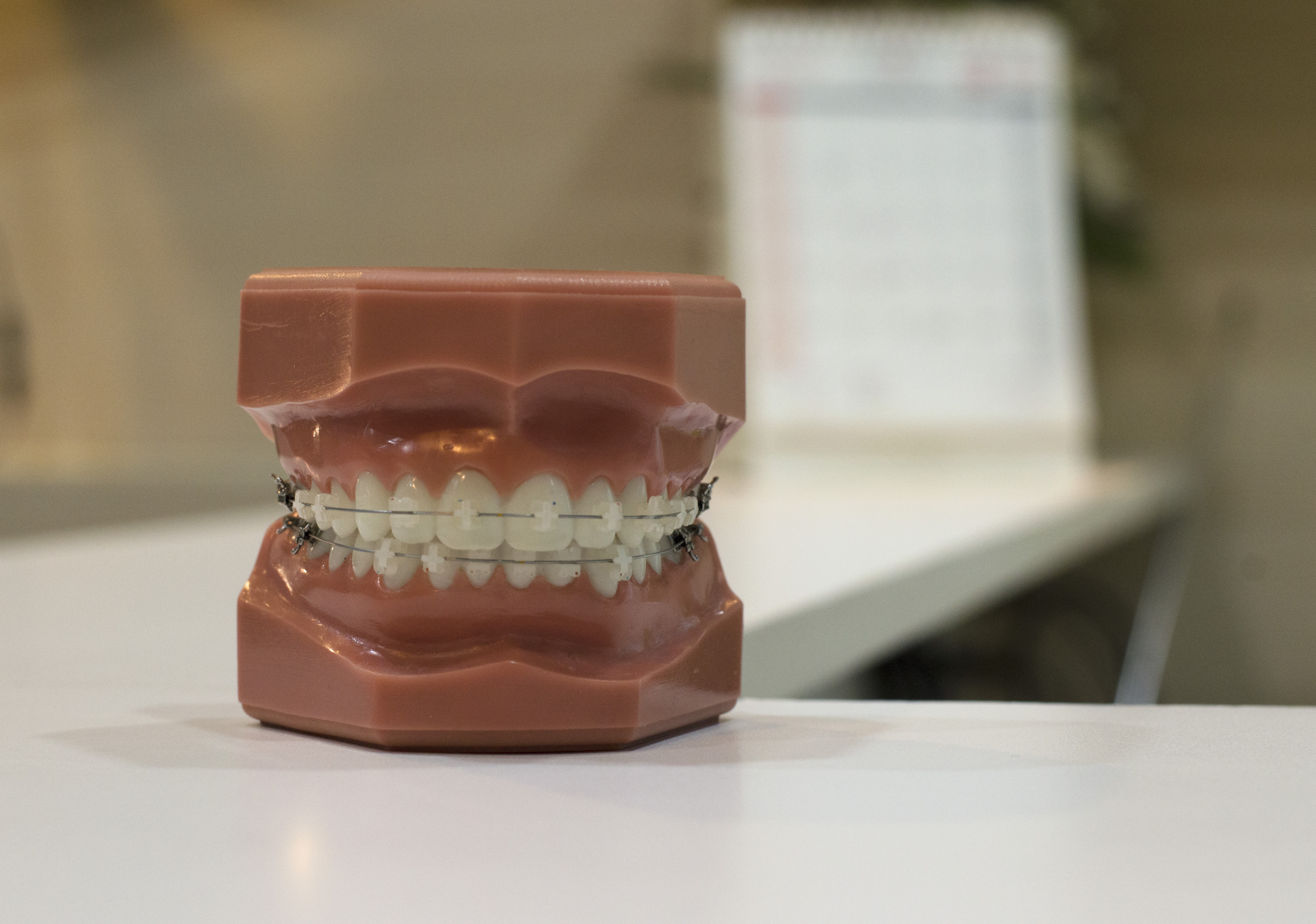brown dentures on white table