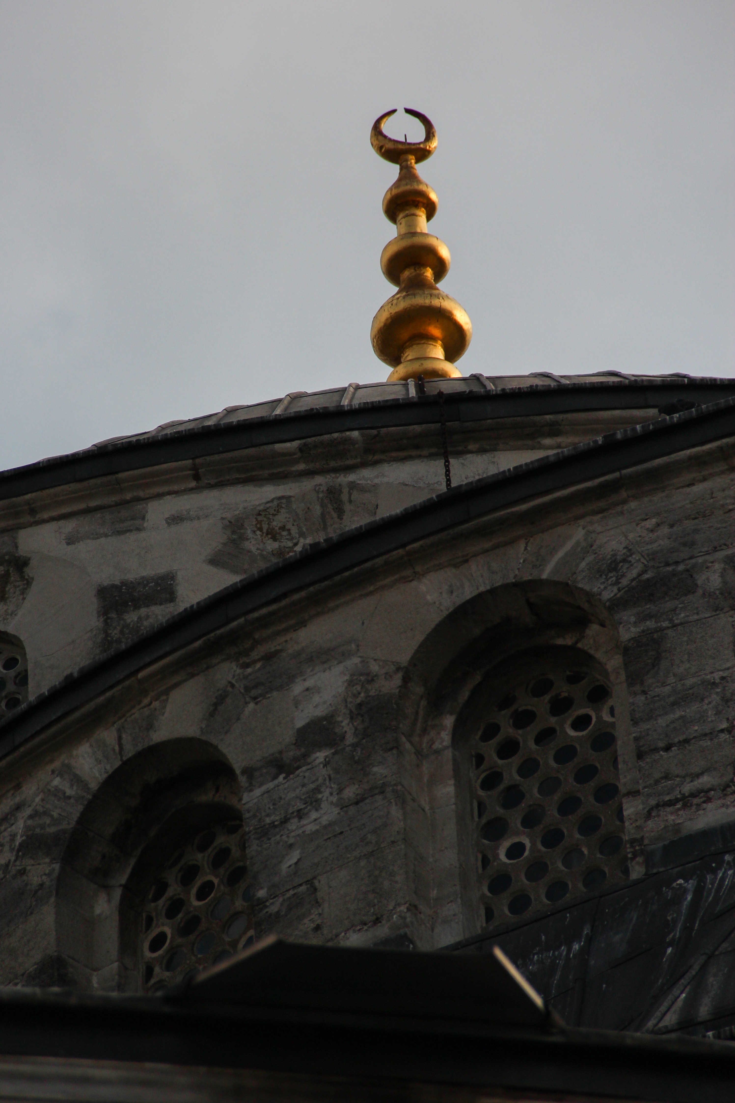 black concrete building with golden tower