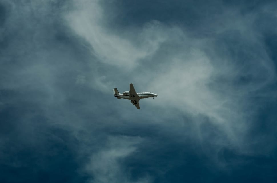 wite \airplane while in air photography preview