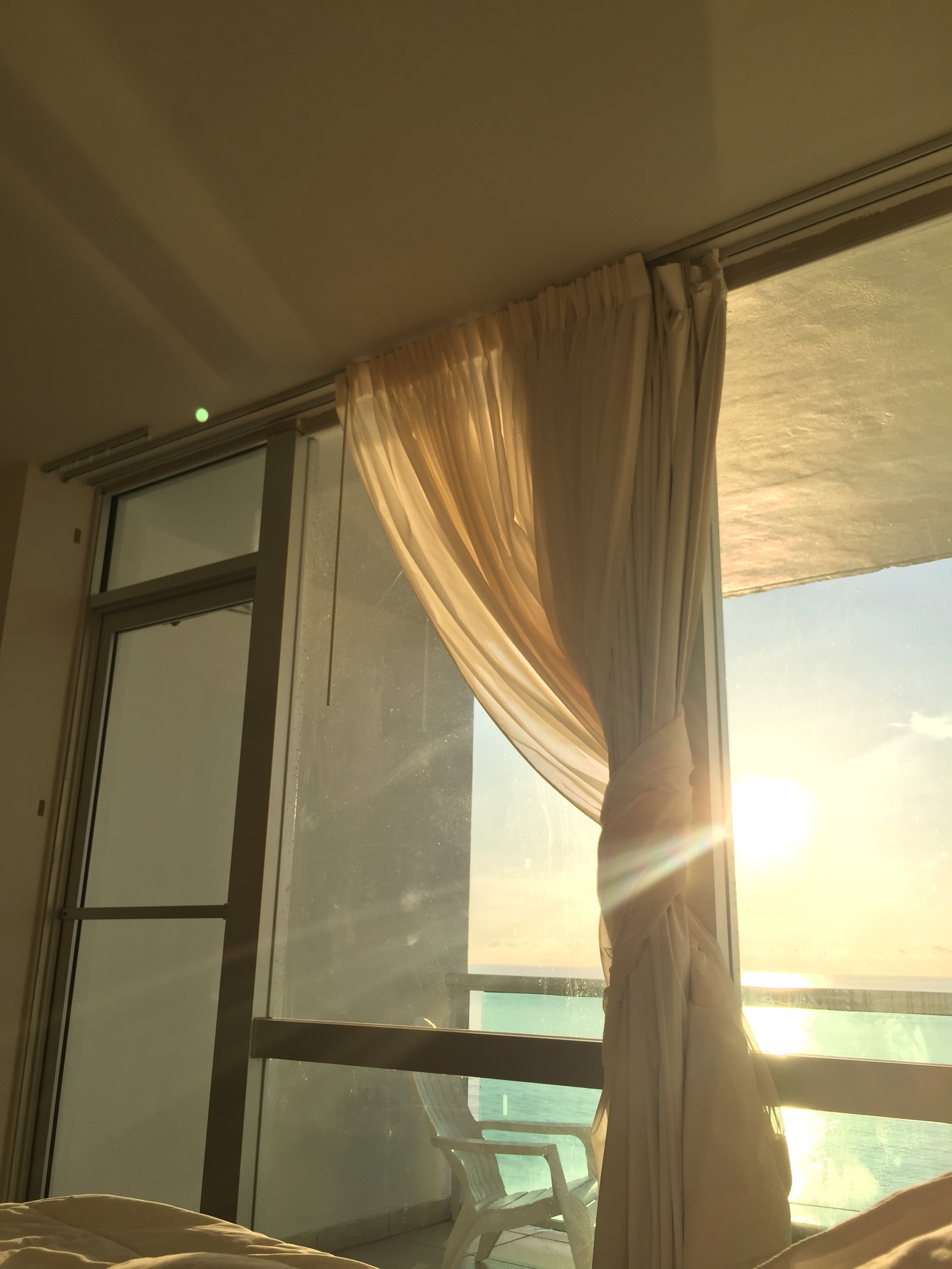beige window curtain