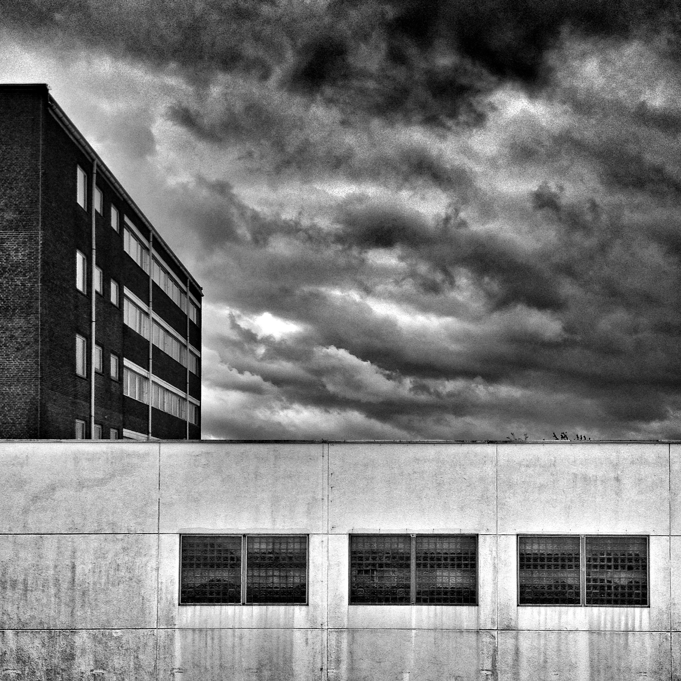 grayscale photo of concrete buildings