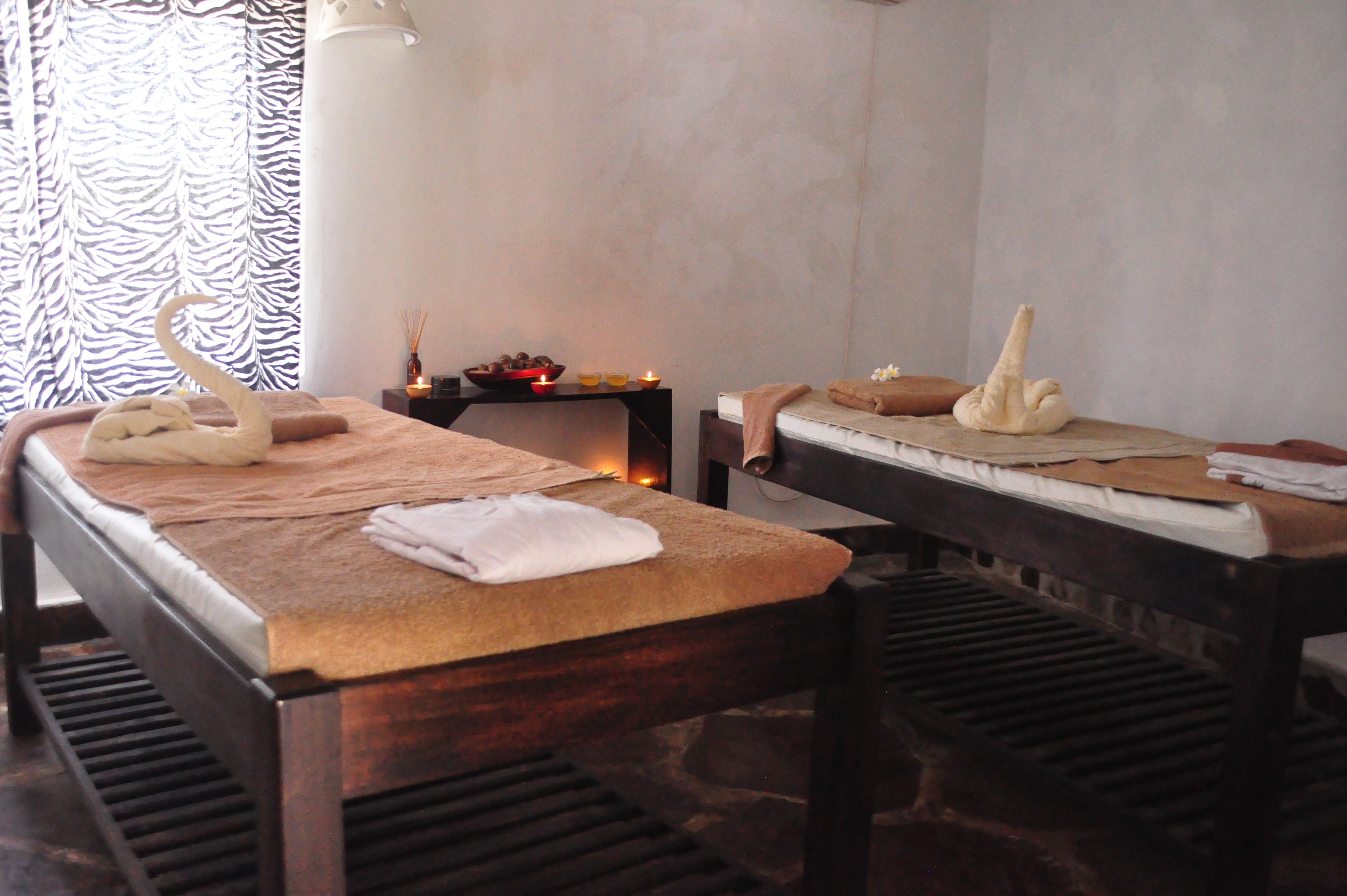brown wooden padded massaging bed set