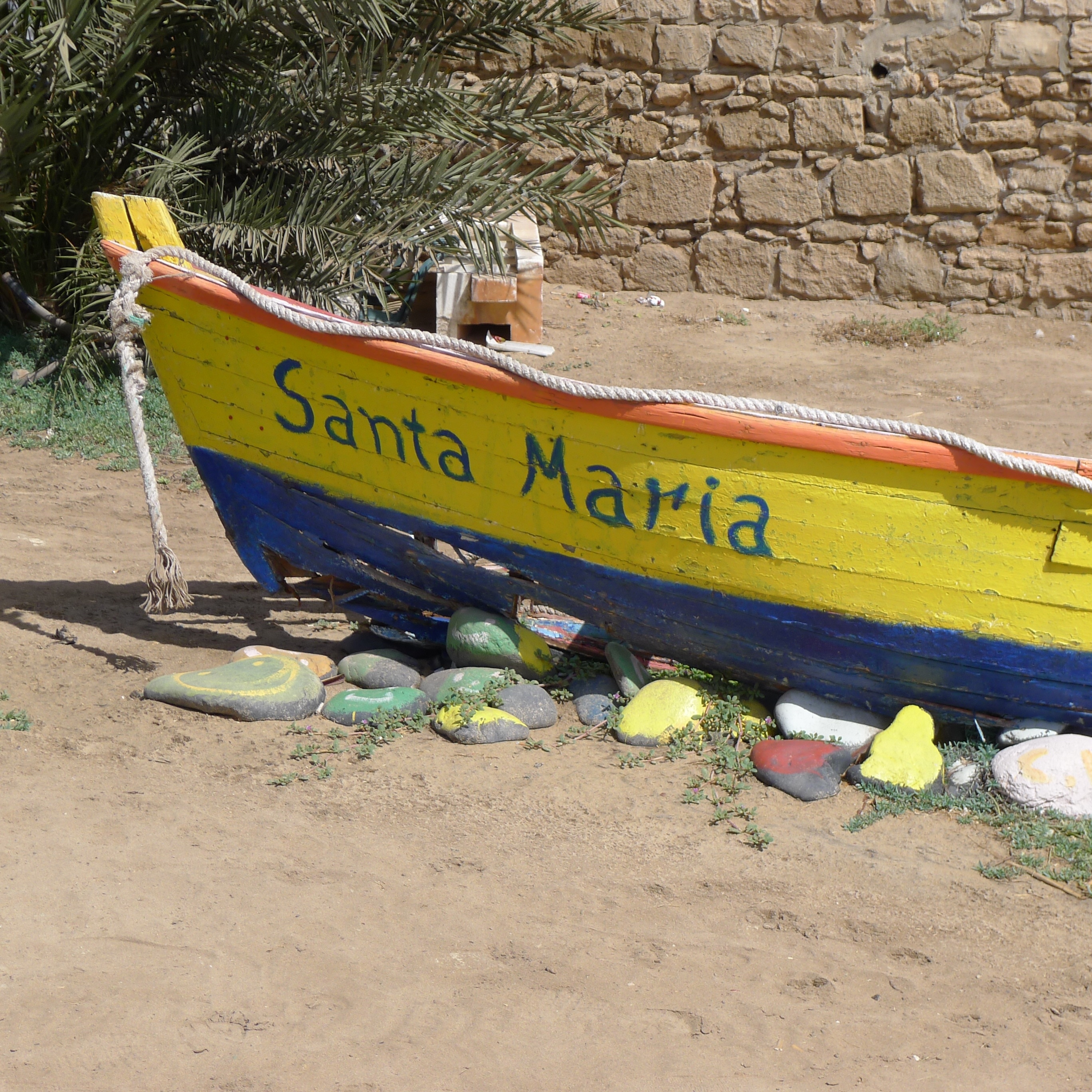 yellow orange and blue santa maria boat