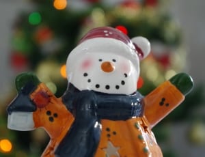 snowman in black scarf ceramic figurine thumbnail