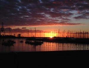 boats near dock during sunset thumbnail