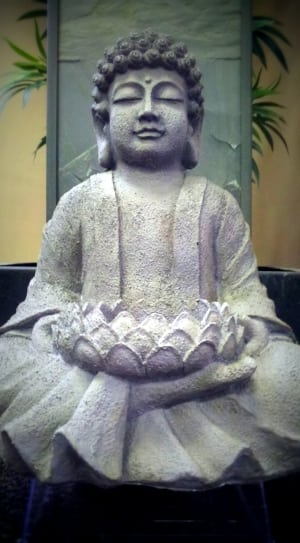gray ceramic buddha figurine thumbnail