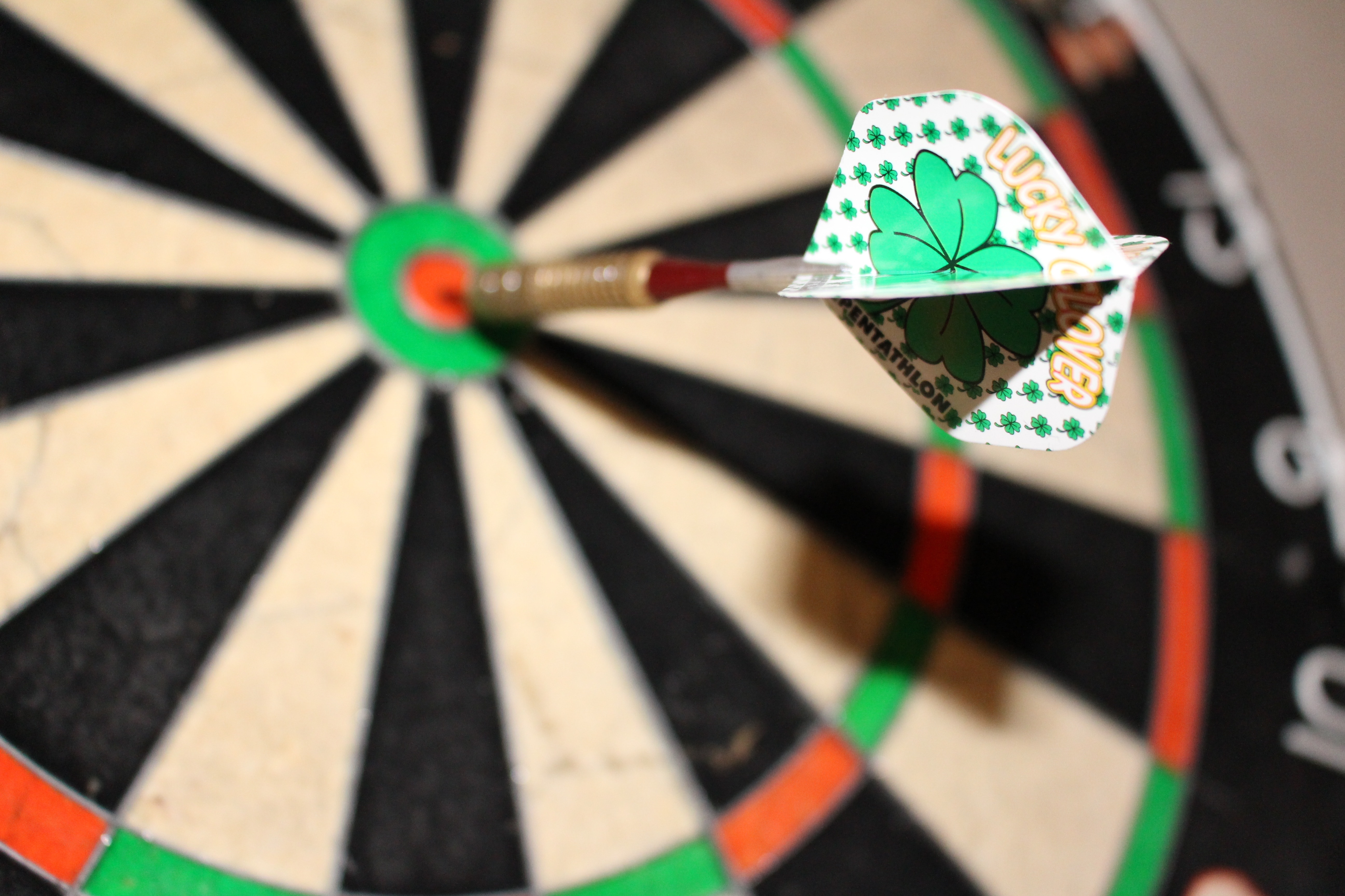 green and white dart and black and white dart board