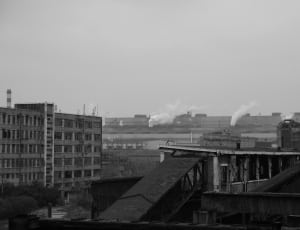 grayscale photo of white concrete high rise building thumbnail