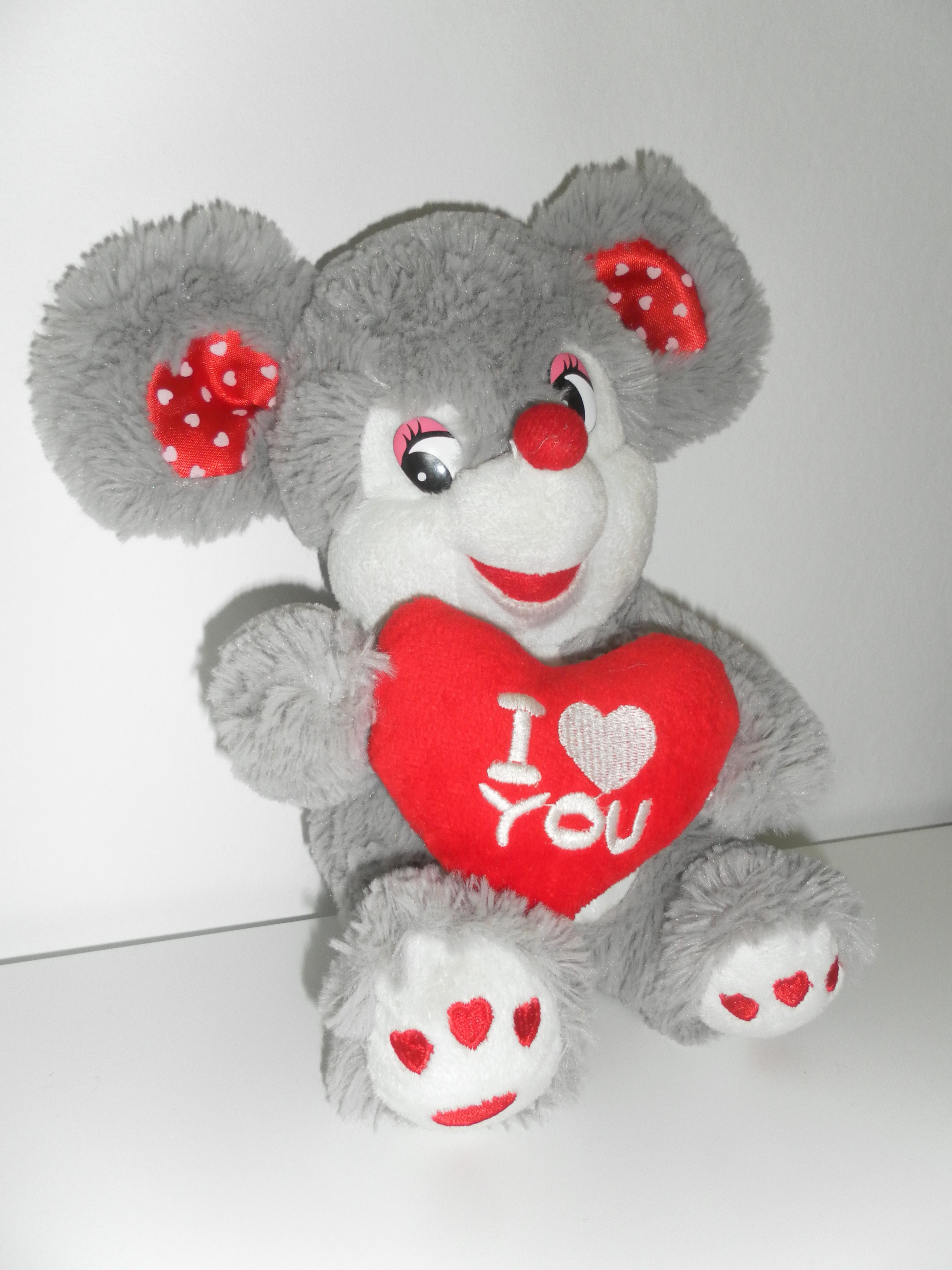 gray white and red mouse plush toy