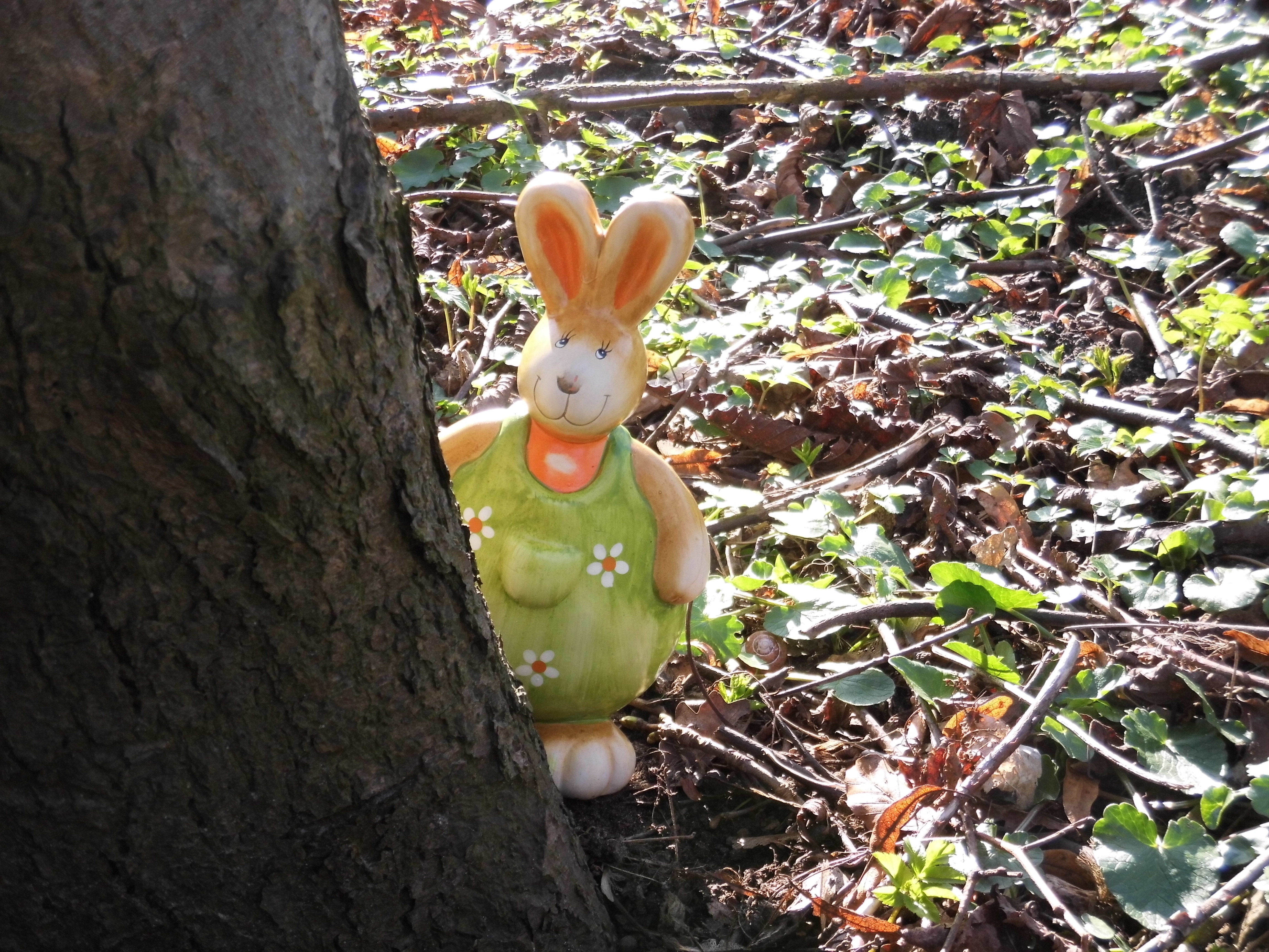 green floral dressed rabbit figurine