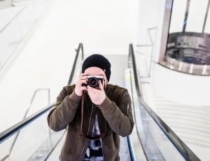 photo of person on escalator while taking phoot thumbnail