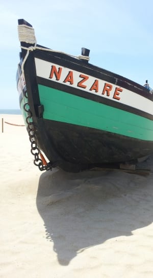 green and black and white nazare water boat thumbnail