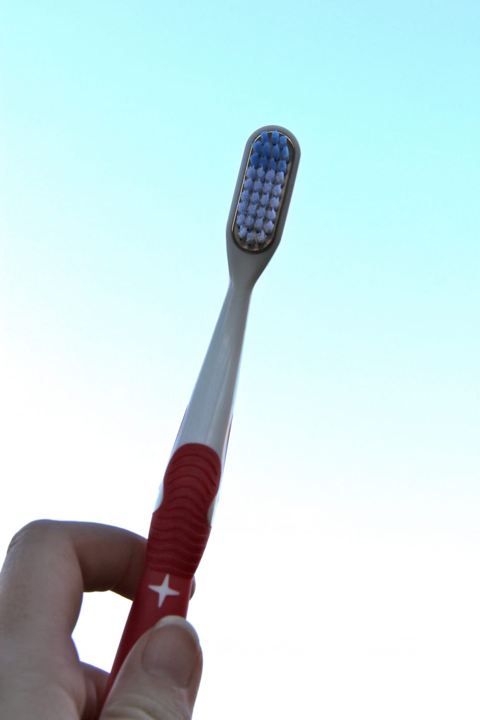 red and white toothbrush preview