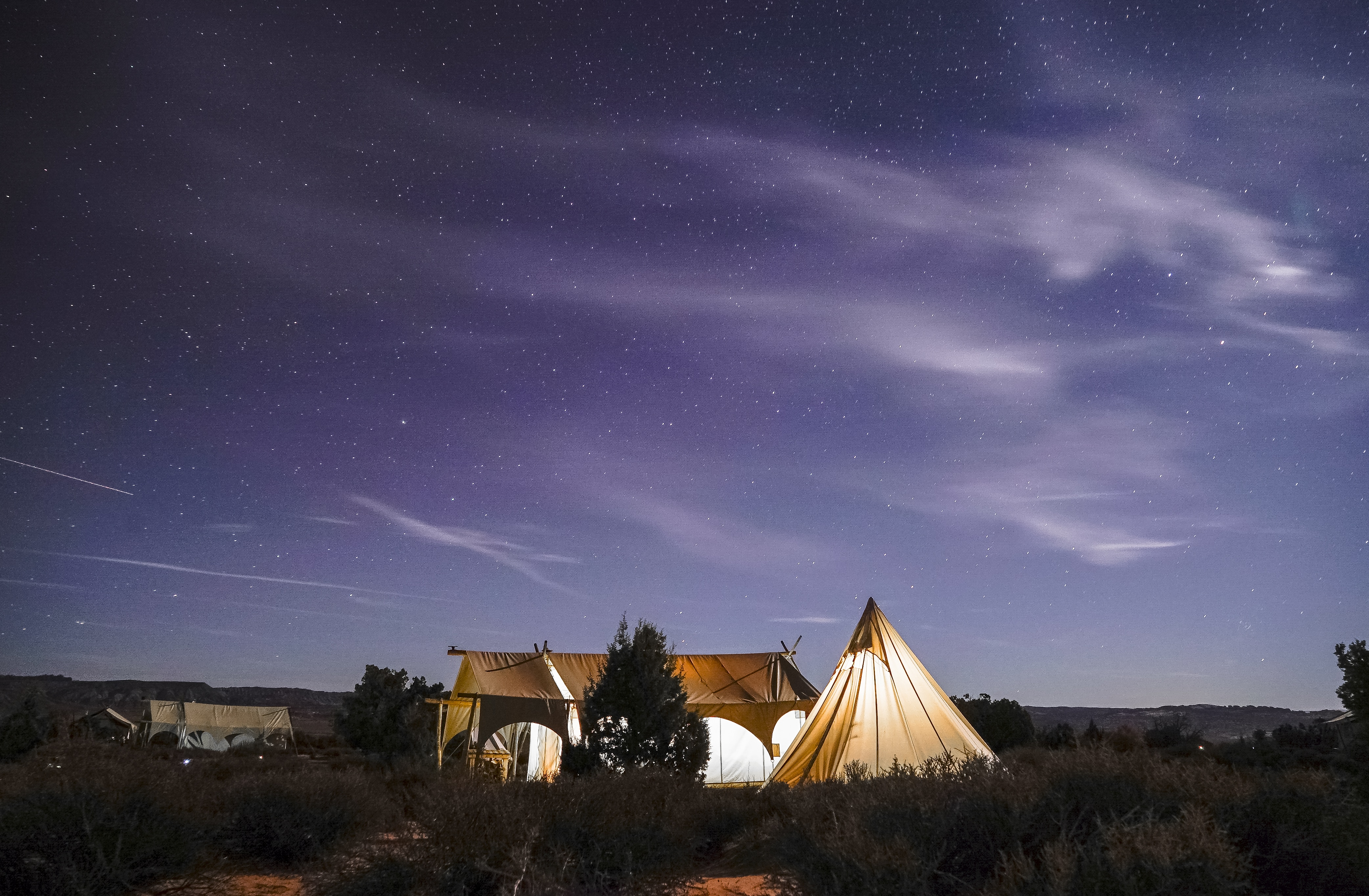 two beige tent under starry night sky