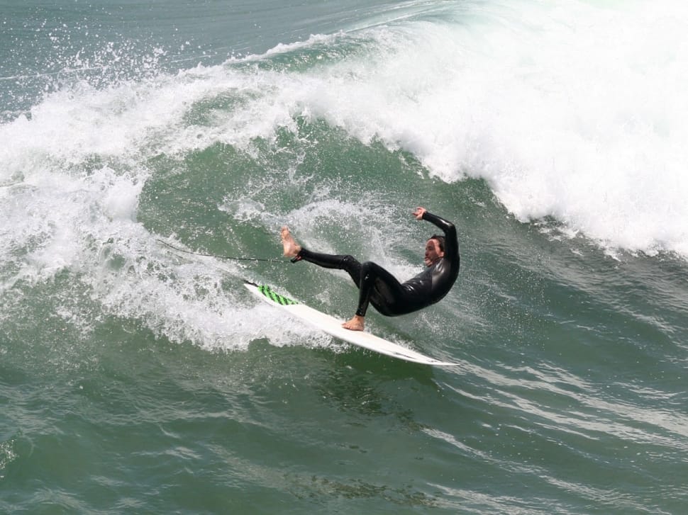 man in black wetsuit and white and green sufrboard preview