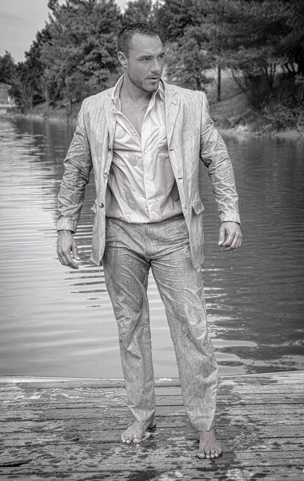 grayscale photo of man wearing blazer and wet preview