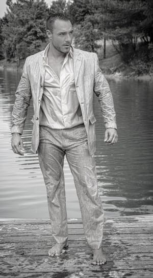 grayscale photo of man wearing blazer and wet thumbnail