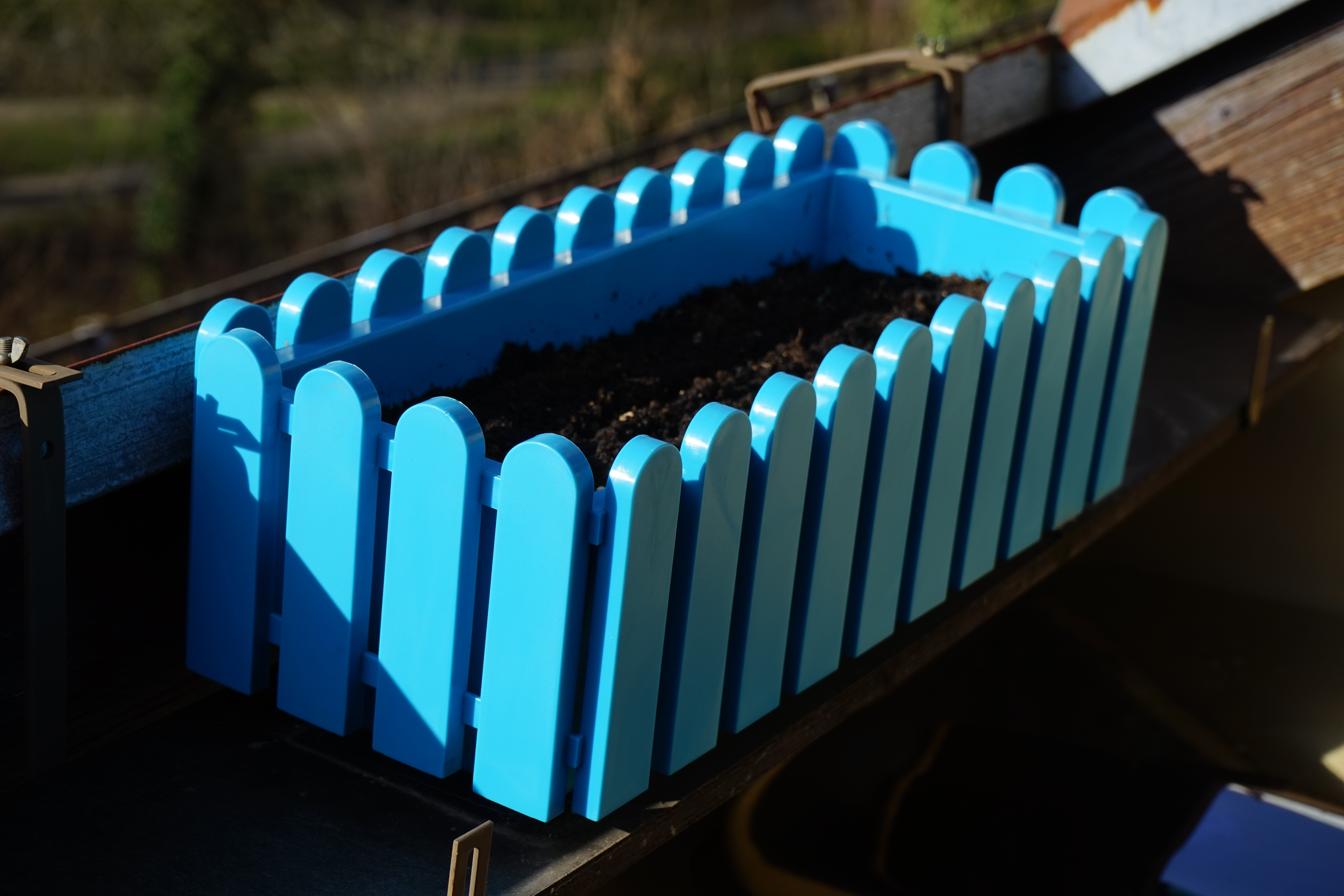 blue wooden rectangular plant pot