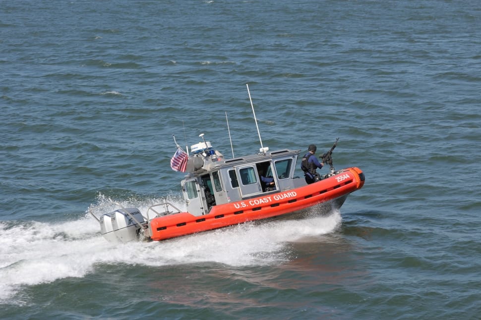 gray and orange u.s coast guard on body of water preview