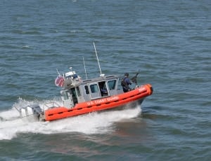 gray and orange u.s coast guard on body of water thumbnail