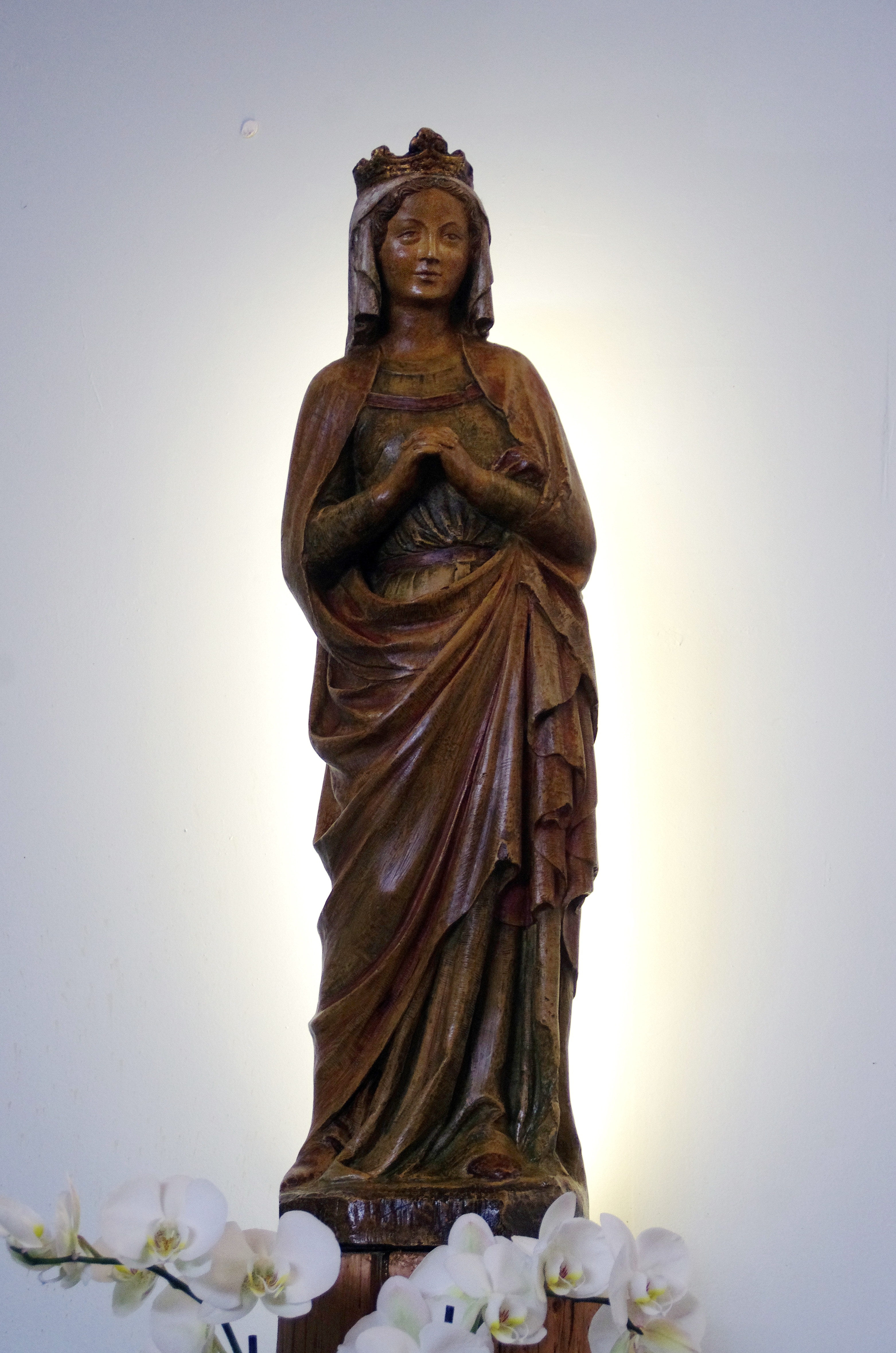 brown wooden religious sculpture