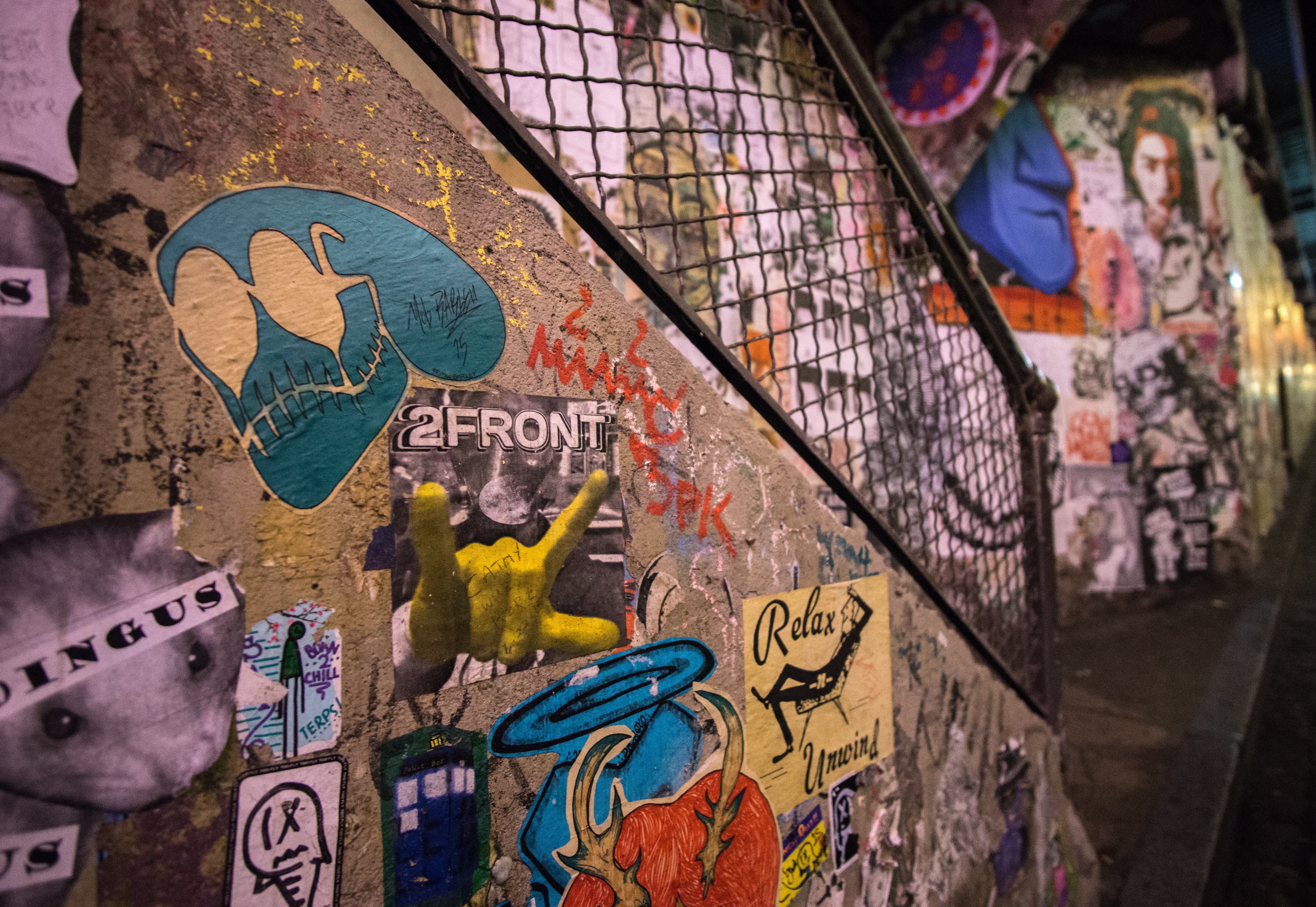 brown concrete stair with graffiti and stickers