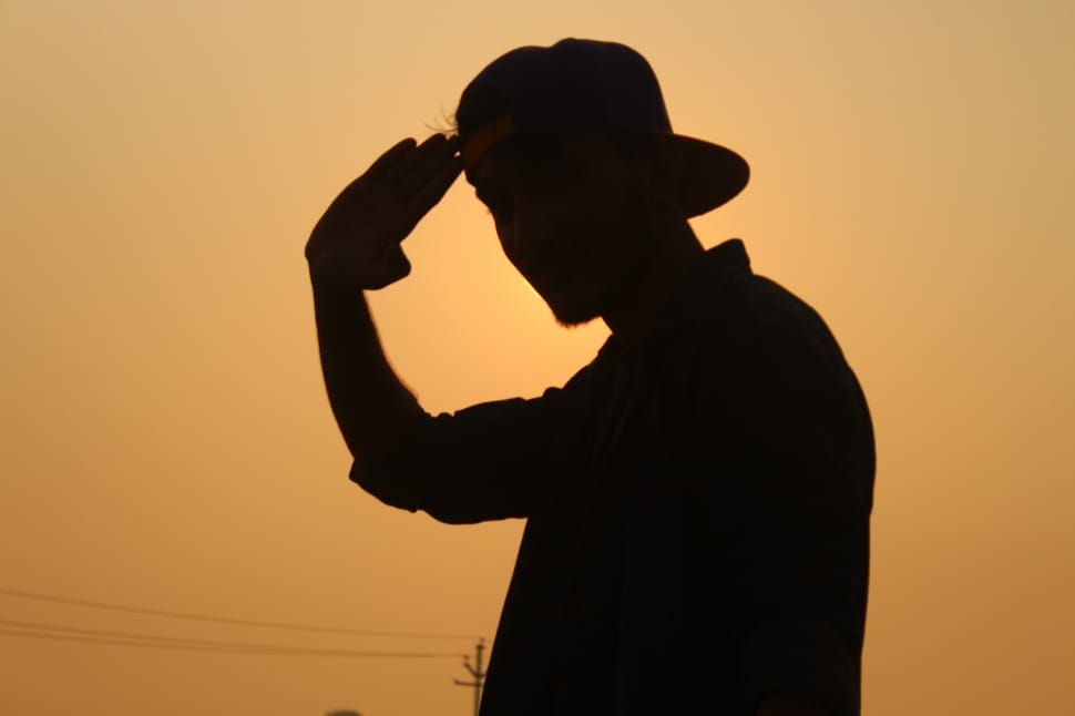 silhouette of man wearing fitted cap preview