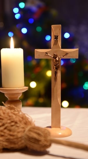 brown cross and white pillar candle decor thumbnail