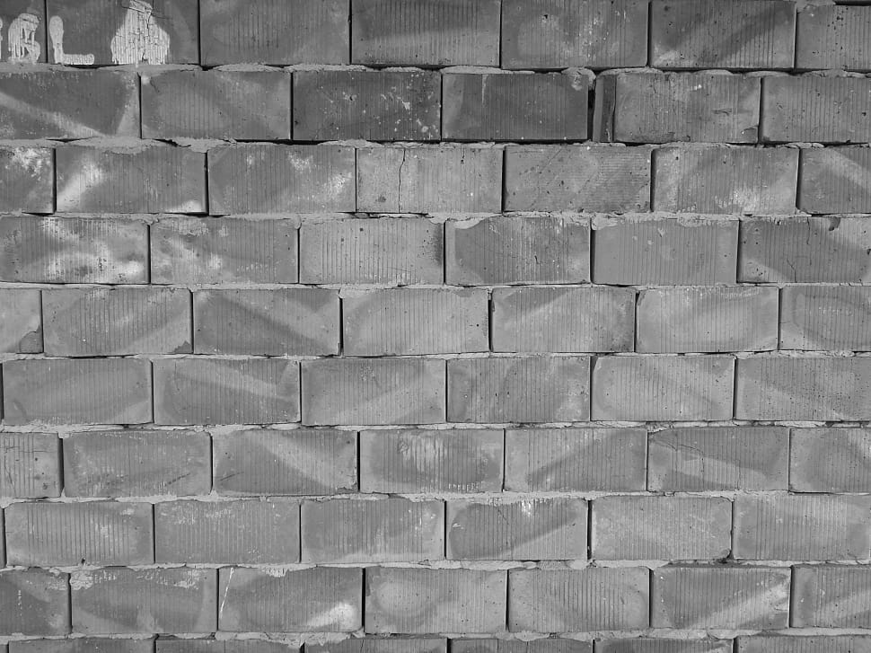 grayscale photo of brick wall preview