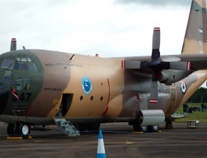 brown c-130 hercules transport military airplane thumbnail