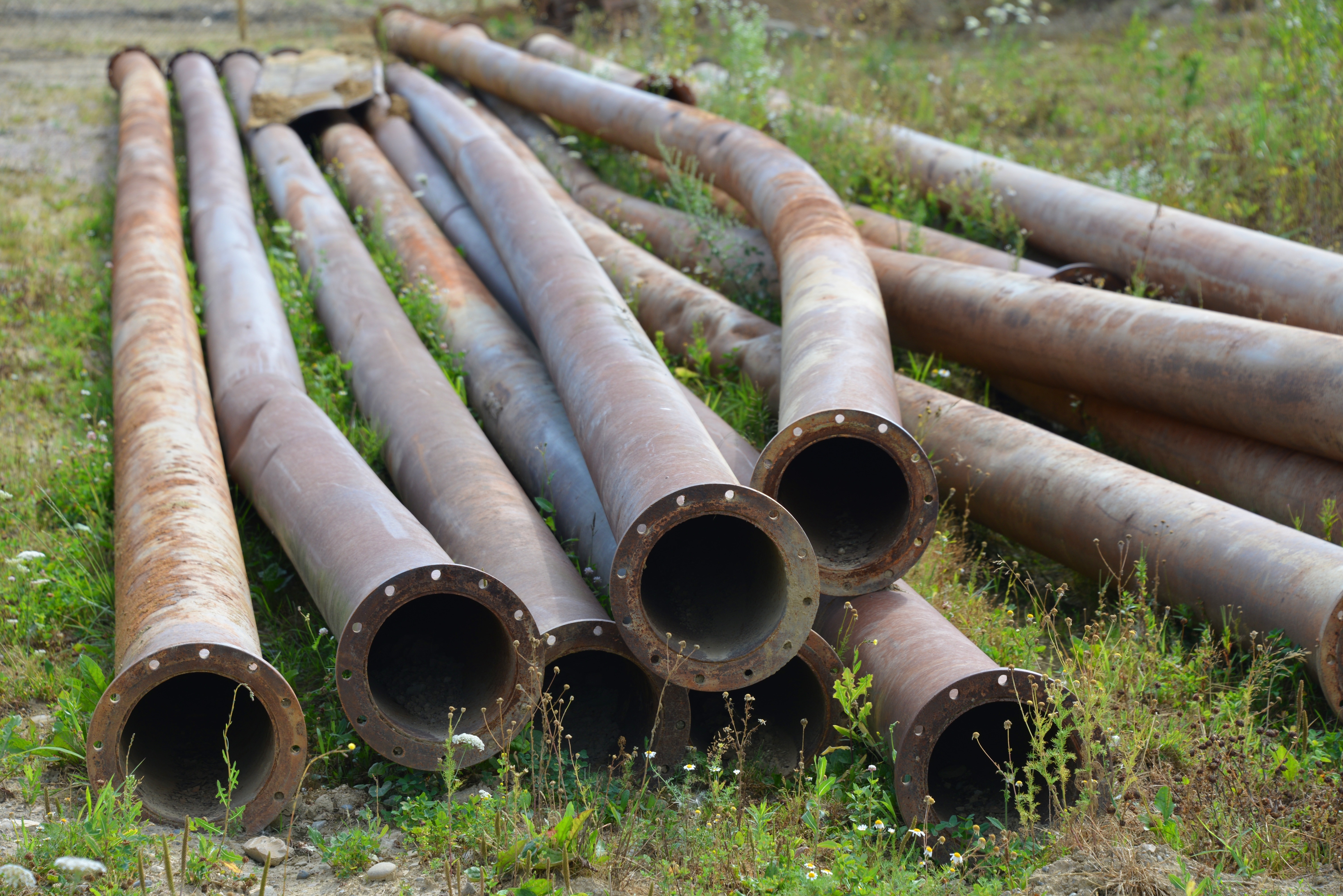 brown metal pipes on ground