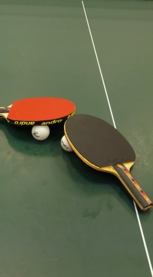 black and red table tennis paddles and balls thumbnail