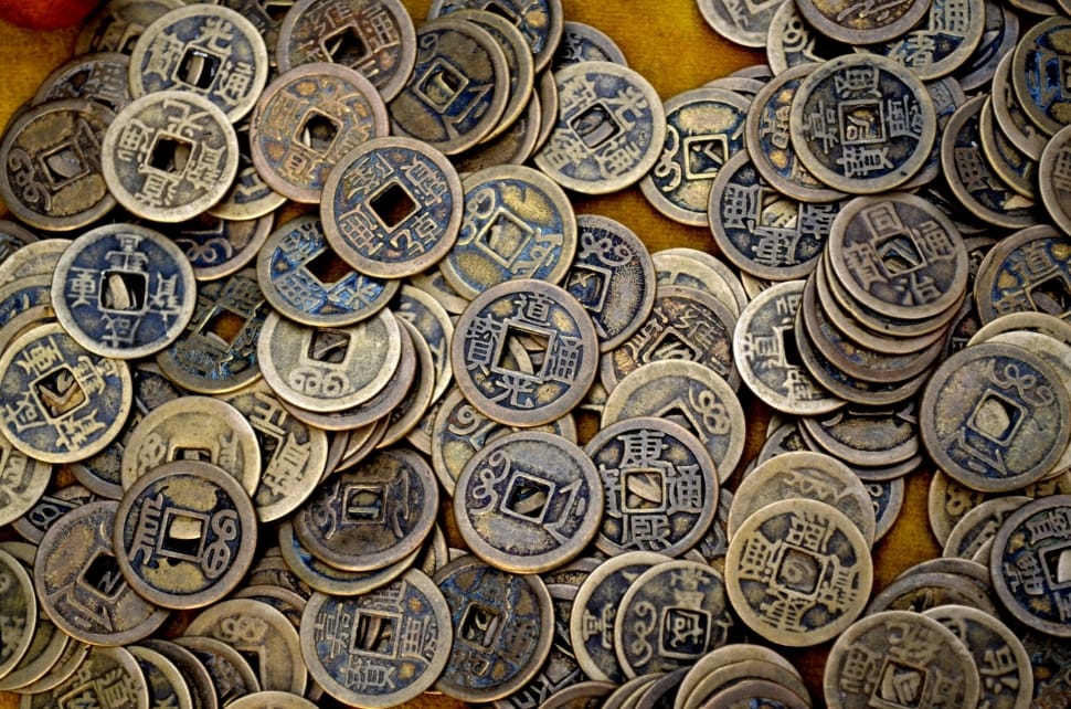 close up photo of stack of ching coins preview