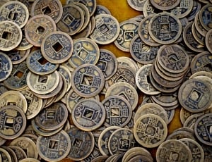 close up photo of stack of ching coins thumbnail