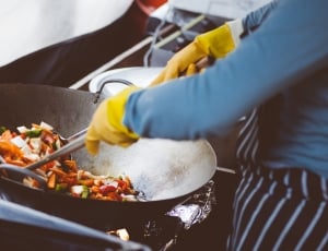 person cooking a food on gas range thumbnail