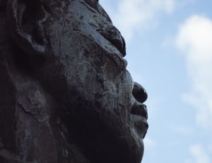 person figure stone sculpture thumbnail