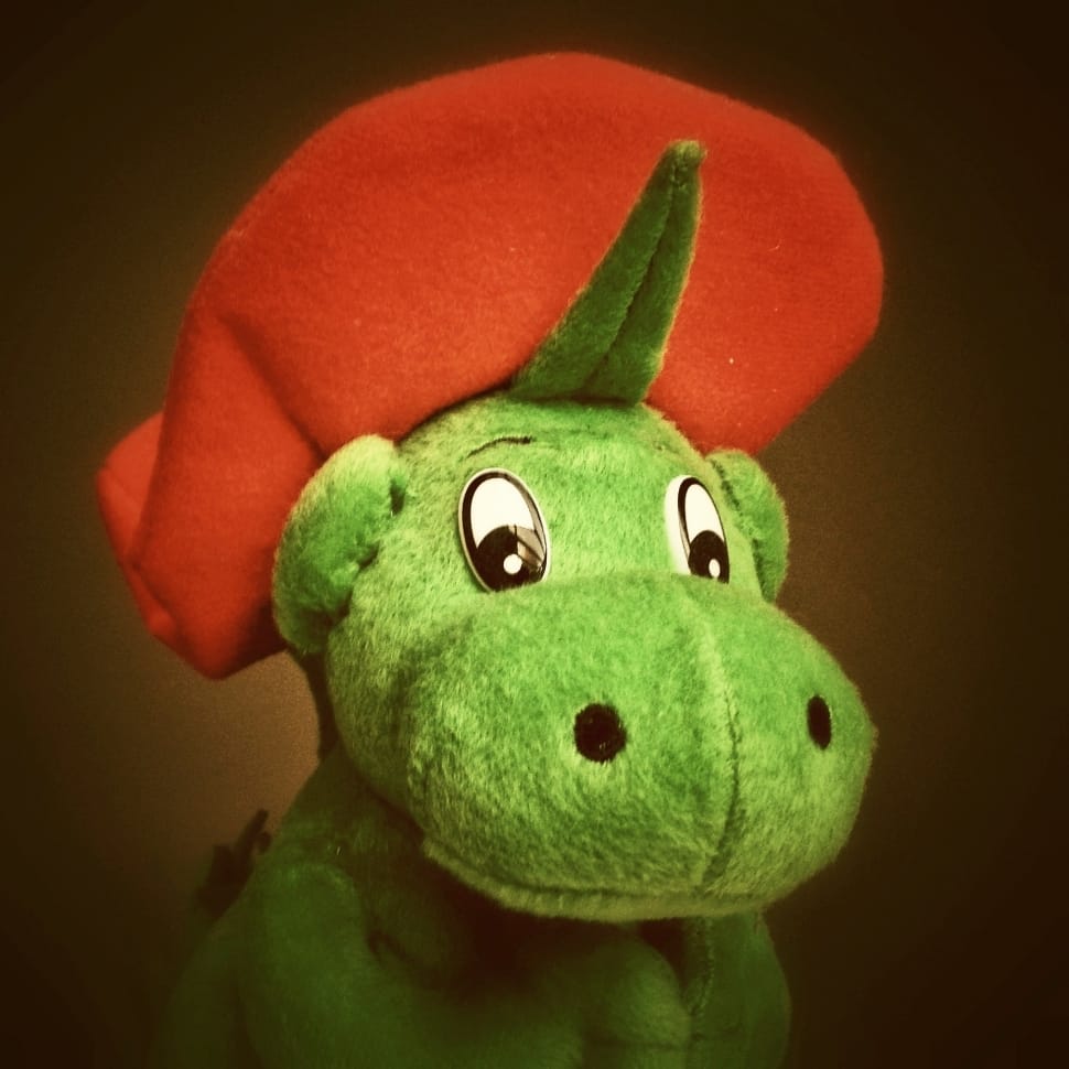red and green dinosaur plush toy preview