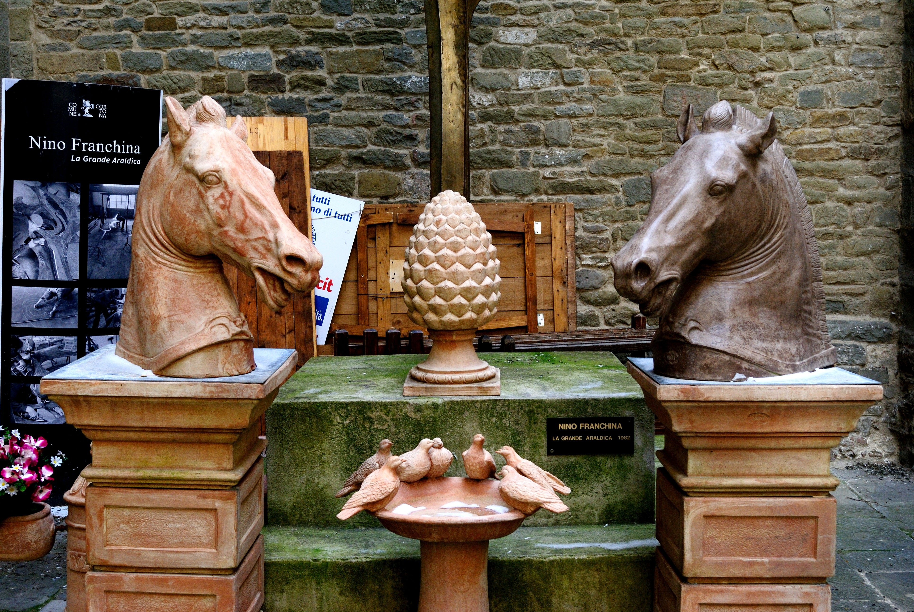brown wooden horse head figurines